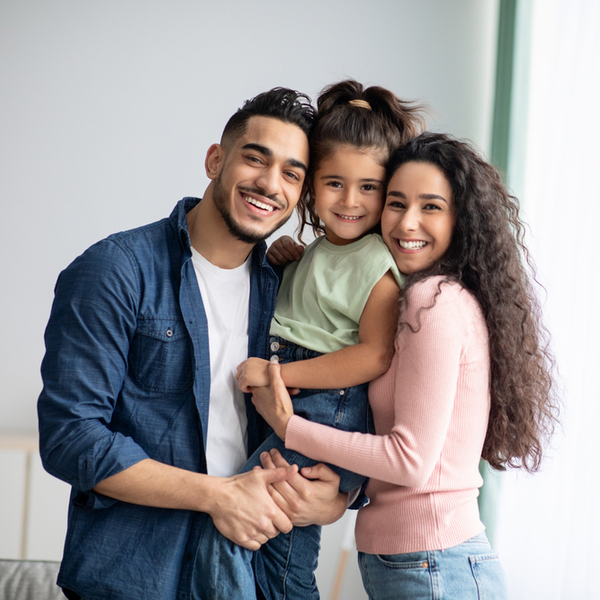 Patient Safety Family of 3 Smiling Indoors