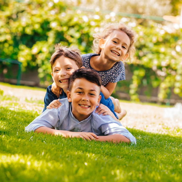 Sealants Children Playing in the Grass