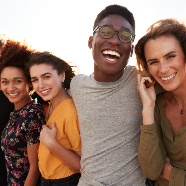 Smile Makeovers Group of Young Adults Smiling and Laughing Outside