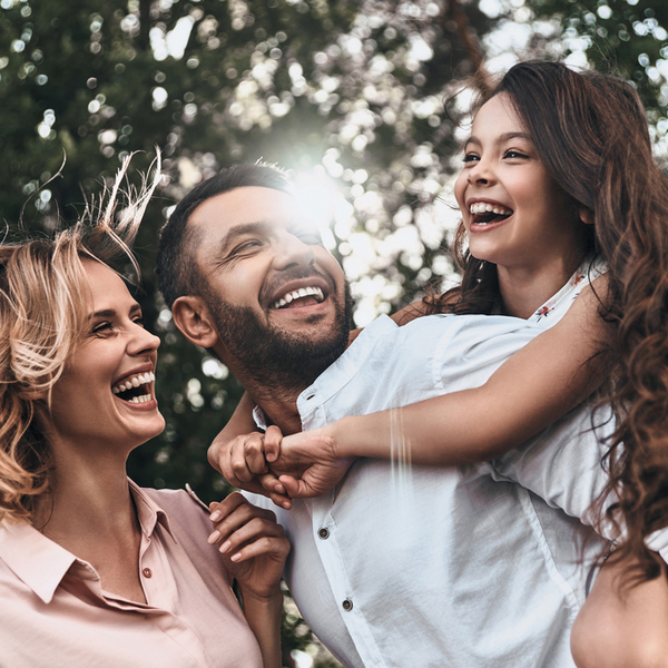 Widsom Tooth Extractions Family of Three Laughing Outdoors